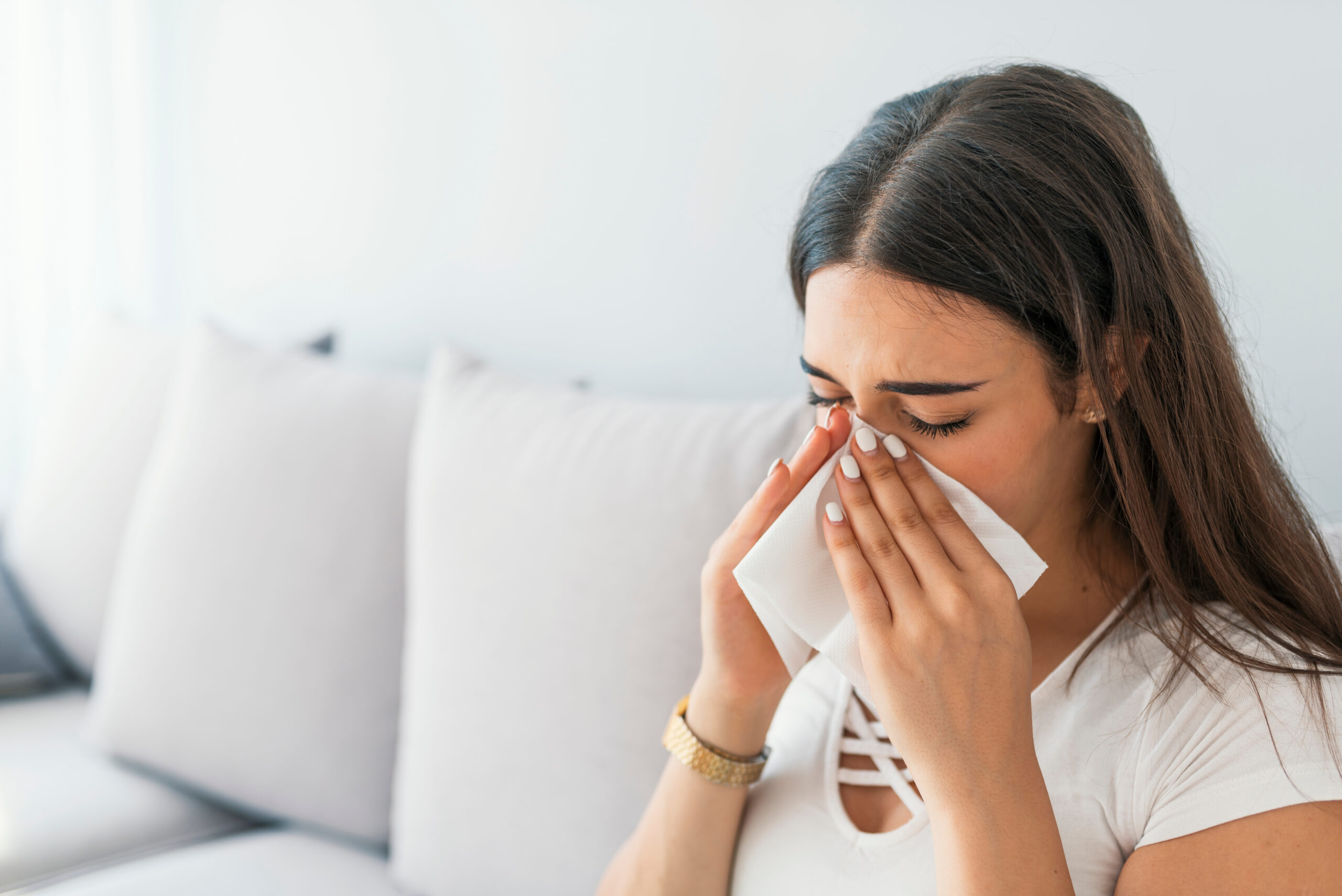 Woman suffering from allergy.